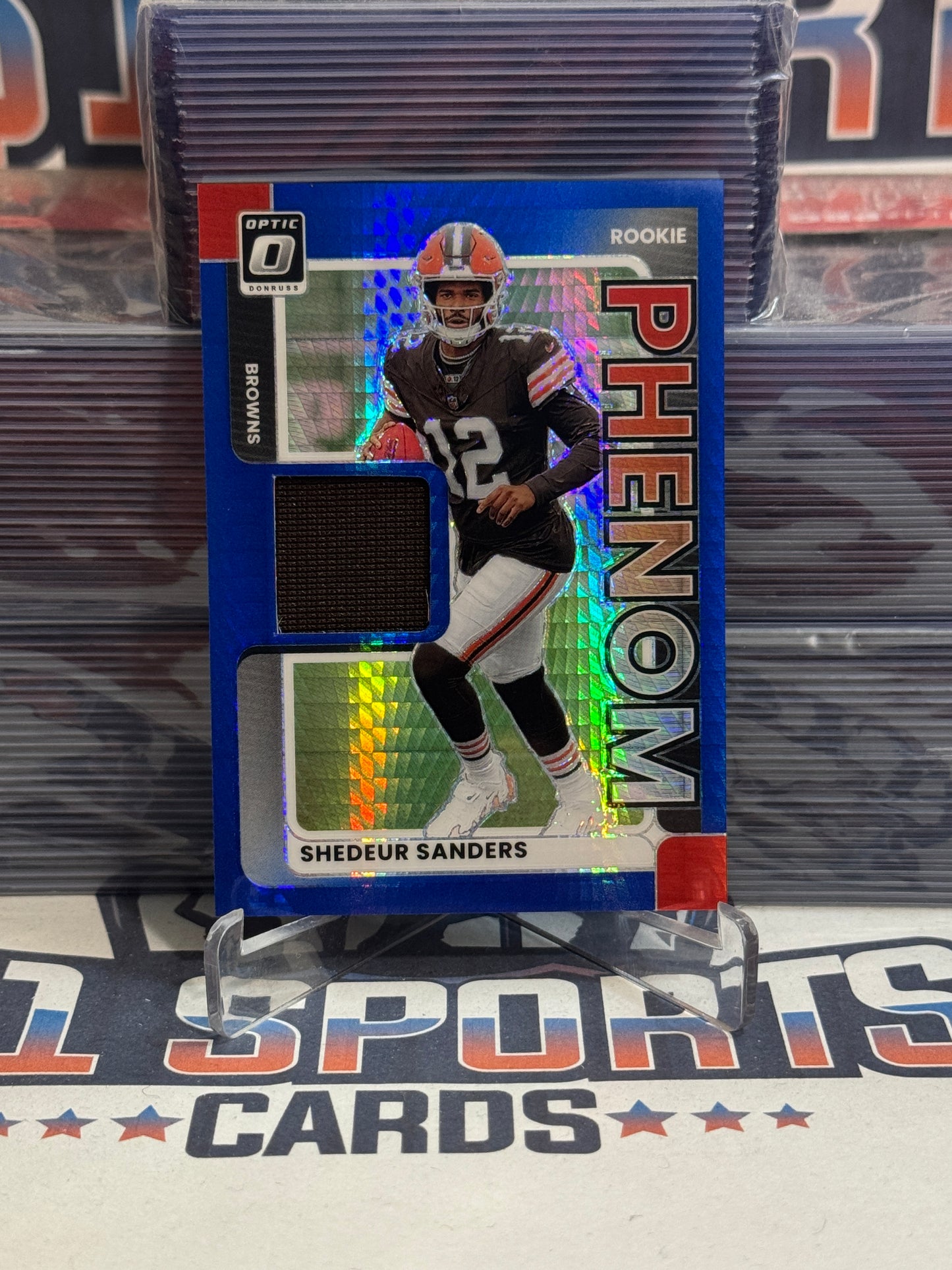 2025 Donruss Optic (Blue Pulsar Prizm, Rookie Phenom Relic) Shedeur Sanders #RPBH-SSS