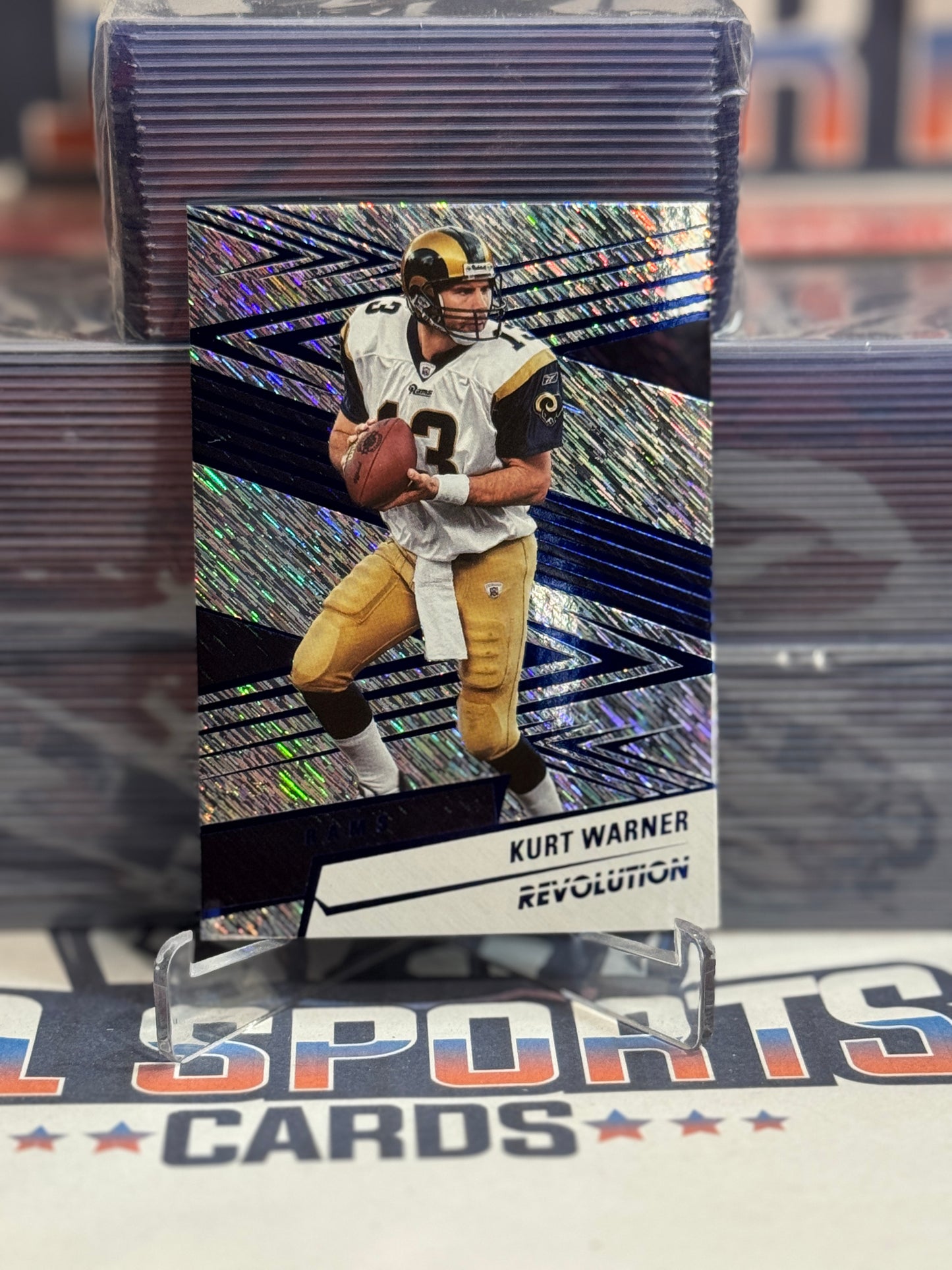 2025 Panini Revolution (Blue 493/549) Kurt Warner #185