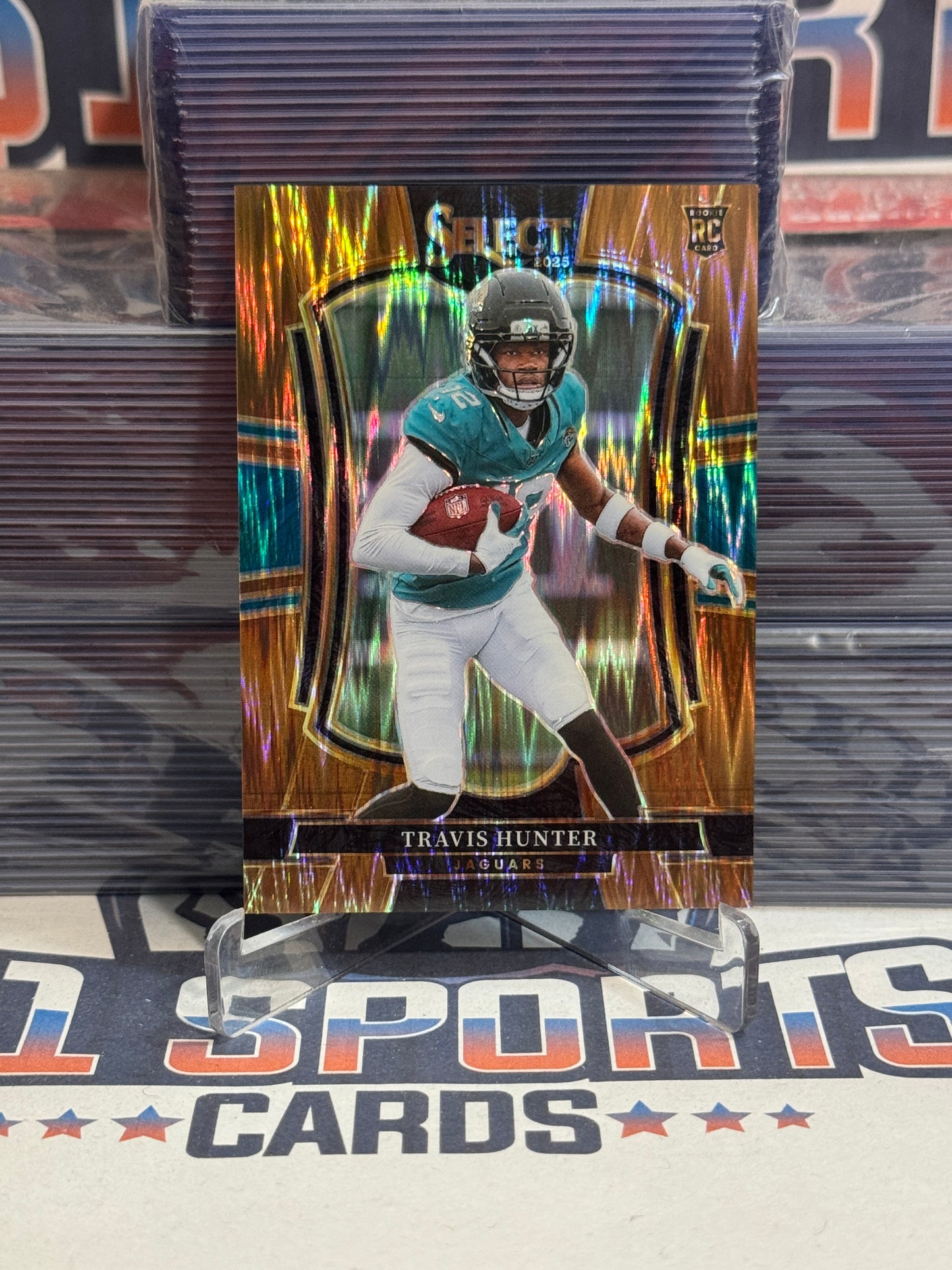 2025 Panini Select (Bronze Shock Prizm 559/899) Travis Hunter Rookie #128