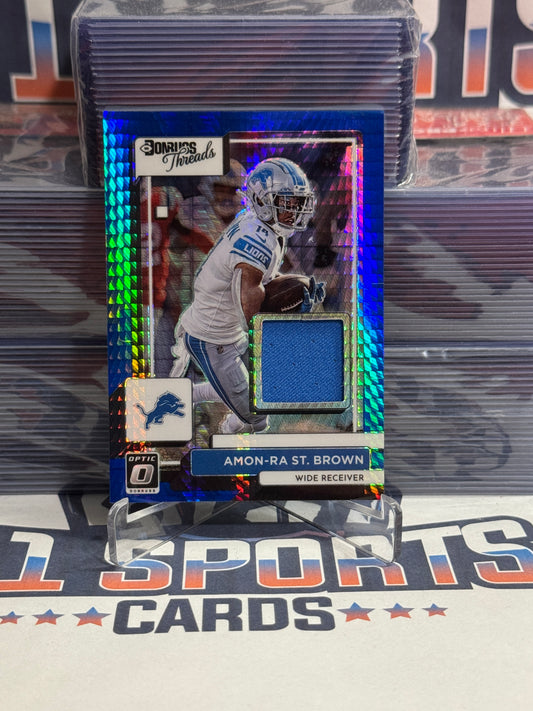 2022 Donruss Optic (Blue Pulsar Prizm, Threads Relic) Amon-Ra St. Brown #DT-ASB