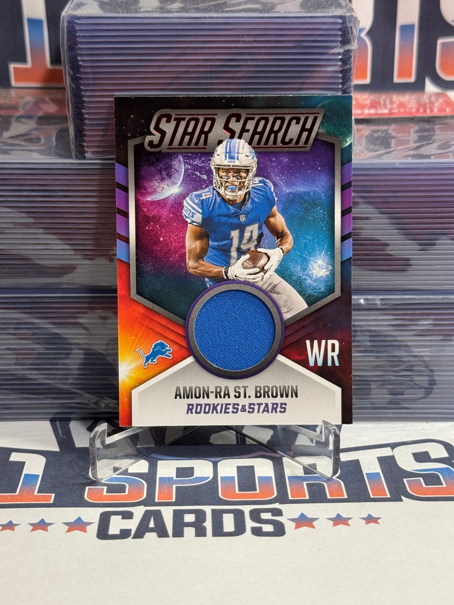 2021 Panini Rookies & Stars (Red, Star Search Relic) Amon-Ra St. Brown Rookie #SS-ASB
